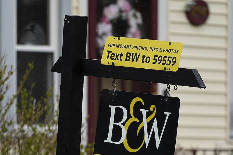 A sign is displayed outside a home in Wheeling, Ill., May 5, 2022. Average long-term U.S. mortgage rates climbed over 6% this week for the first time since the housing crash of 2008, threatening to sideline even more homebuyers from a rapidly cooling housing market. Mortgage buyer Freddie Mac reported Thursday, Sept. 15, 2022 that the 30-year rate rose to 6.02% from 5.89% last week. (AP Photo/Nam Y. Huh)