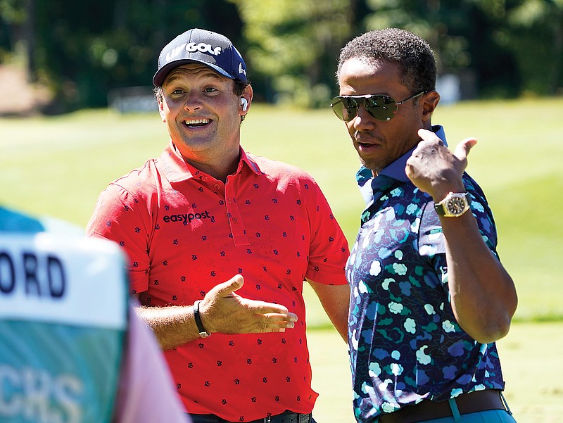 Patrick Reed (left) talks with LIV Golf managing director Majed Al Sorour before the start of the first round of the LIV Golf Tournament earlier this month in Bolton, Mass. (Associated Press)