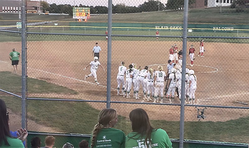 Blair Oaks designated player Kenadi Braun (left) heads toward home plate to join her teammates after hitting a walk-off grand slam to end Tuesday's game against Southern Boone at the Falcon Athletic Complex in Wardsville. (Greg Jackson/News Tribune)