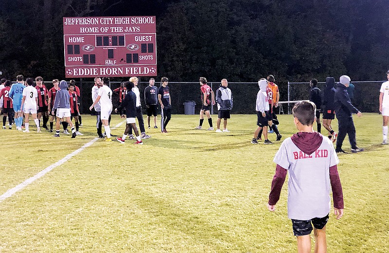 The Jefferson City Jays and Rock Bridge Bruins shake hands after Tuesday night's Central Missouri Activities Conference match at the 179 Soccer Park. (Tom Rackers/News Tribune)