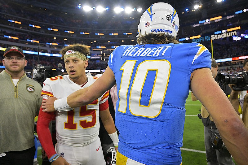 Chiefs quarterback Patrick Mahomes and Chargers quarterback Justin Herbert greet each other after the Chiefs defeated the Chargers 30-27 in Sunday night's game in Inglewood, Calif. (Associated Press)