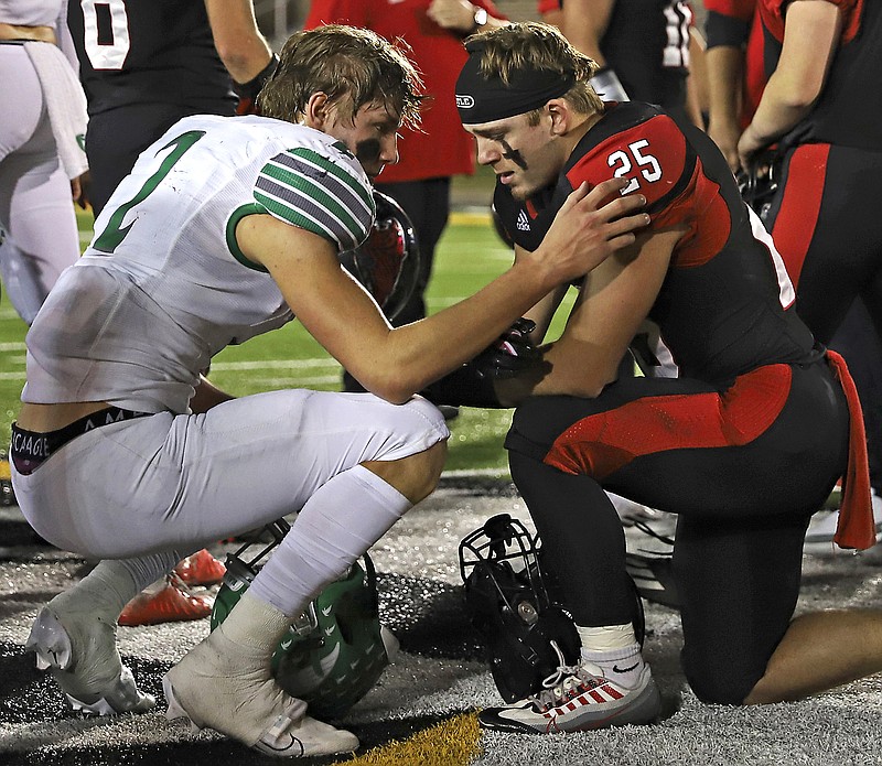 Alec Wieberg of Blair Oaks consoles Lamar running back Logan Kish after Friday's Class 2 state championship game at Faurot Field in Columbia. (Kate Cassady/News Tribune)