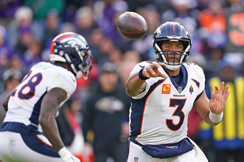 Broncos quarterback Russell Wilson passes in the first half of Sunday’s game against the Ravens in Baltimore. (Associated Press)