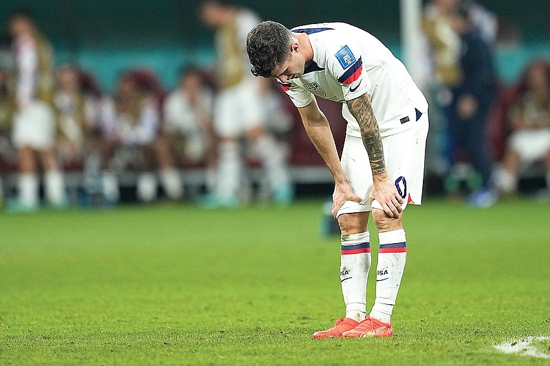 Christian Pulisic of the United States is dejected after Saturday’s World Cup round of 16 soccer match against the Netherlands at Khalifa International Stadium in Doha, Qatar. The Netherlands won 3-1. (Associated Press)