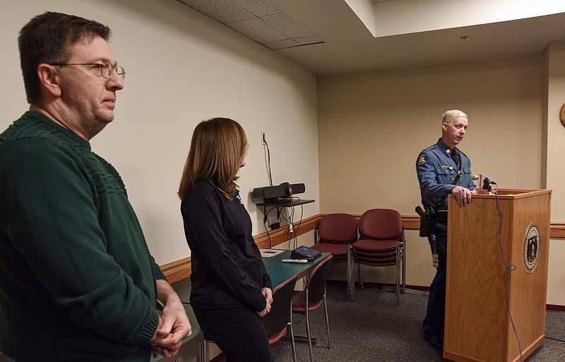 Jason Schafer, District 5 maintenance engineer, at left, and Machelle Watkins, district engineer, listen as Cpt. John Hotz of the Missouri State Highway Patrol answers questions during a news conference Wednesday at MoDOT District 5 Headquarters on Missouri Boulevard.  The trio were advising motorists to take plenty of precautions in getting through the forecasted winter weather expected to hit over night and into Thursday.