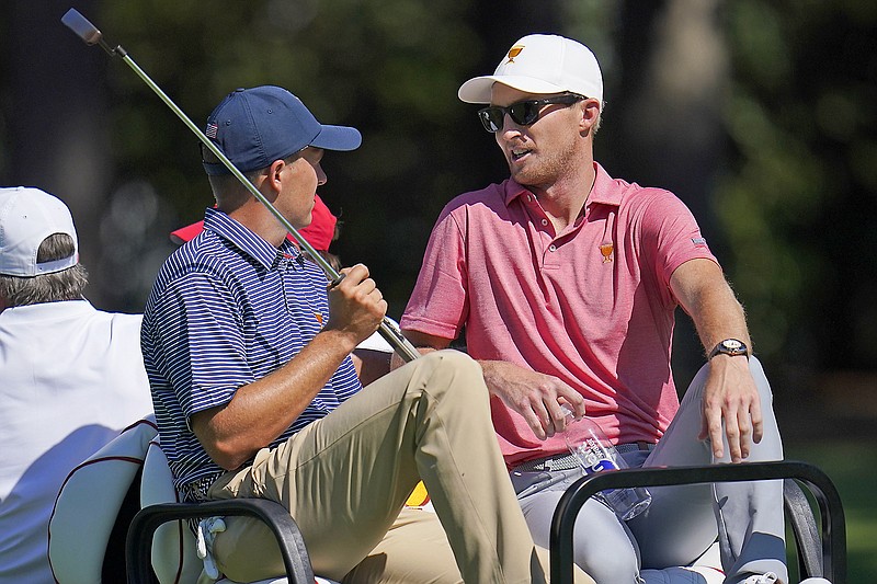 In this Sept. 21, 2022, file photo, Jordan Spieth (left) speaks with Will Zalatoris during practice for the Presidents Cup at Quail Hollow Club in Charlotte, N.C. (Associated Press)