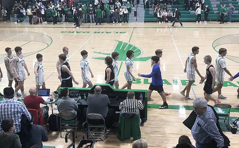 Players for the Blair Oaks Falcons and the Boonville Pirates meet in the handshake line following Friday night's game at Blair Oaks High School in Wardsville. (Greg Jackson/News Tribune)