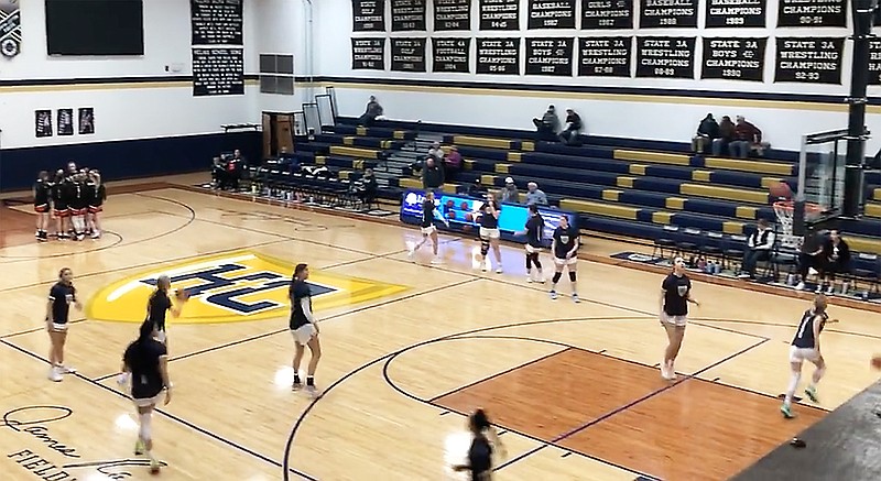 The Helias Lady Crusaders warm up prior to the start of Monday night's game against the Owensville Dutchgirls at Rackers Fieldhouse. (Tom Rackers/News Tribune)