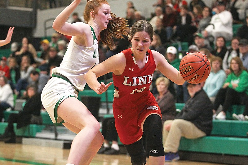 Linn’s Hannah Hackmann tries to drive the ball around Autumn Bax of Blair Oaks during Wednesday night’s game at Blair Oaks High School in Wardsville. (Greg Jackson/News Tribune)