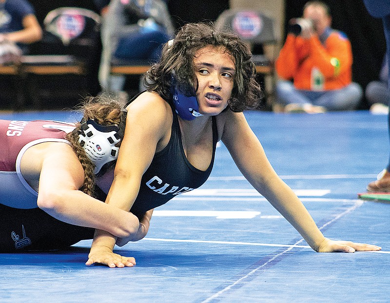 Capital City’s Jacinda Espinosa attempts to work her way free from Rockwood Summit’s Madeline Hayes during their semifinal match at 140 pounds Saturday in the Class 2 girls wrestling state championships at Mizzou Arena in Columbia. (Kate Cassady/News Tribune)