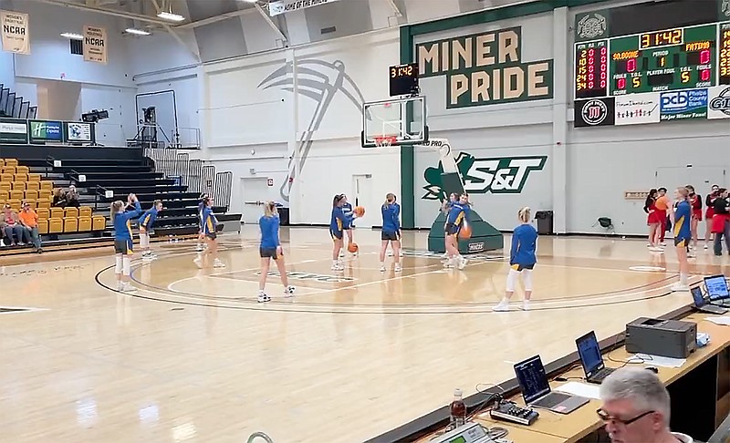 The Fatima Lady Comets warm up on the court before the start of Tuesday night's Class 4 sectional game against the Southern Boone Lady Eagles at Missouri S&T's Gibson Arena in Rolla. (Kyle McAreavy/News Tribune)