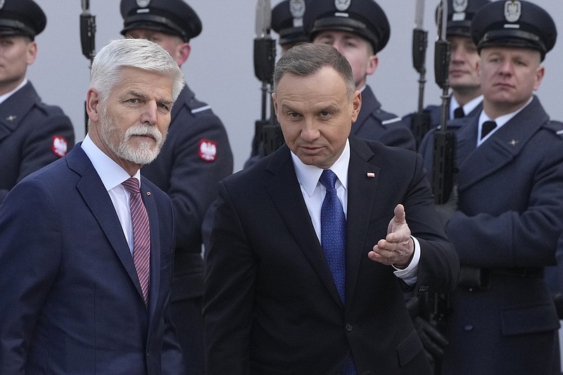 Poland's President Andrzej Duda, right, welcomes Czech Republic's President Petr Pavel as they meet at the Presidential Palace in Warsaw, Poland, Thursday, March 16, 2023. (AP Photo/Czarek Sokolowski)