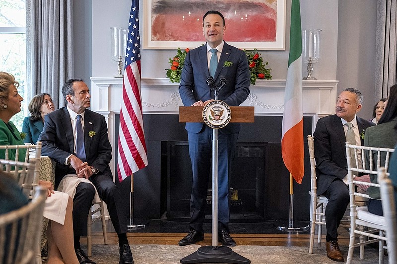 Ireland's Taoiseach Leo Varadkar, center, accompanied by Vice President Kamala Harris, seated at left, speaks during a St. Patrick's Day Breakfast at the Vice President's residence in Washington, Friday, March 17, 2023. (AP Photo/Andrew Harnik)