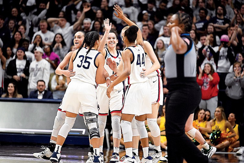 UConn players celebrate in the second half of Monday’s second-round NCAA Tournament victory against Baylor in Storrs, Conn. (Associated Press)