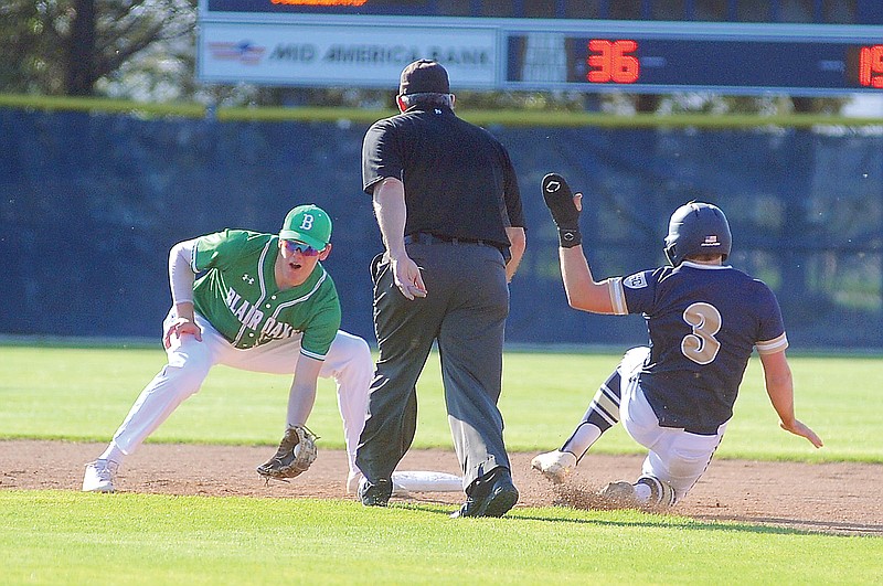 Sam Wyrick of Helias steals second base ahead of the tag by Blair Oaks shortstop Holden Brand during Monday night’s game at the American Legion Post 5 Sports Complex. (Shaun Zimmerman/News Tribune)