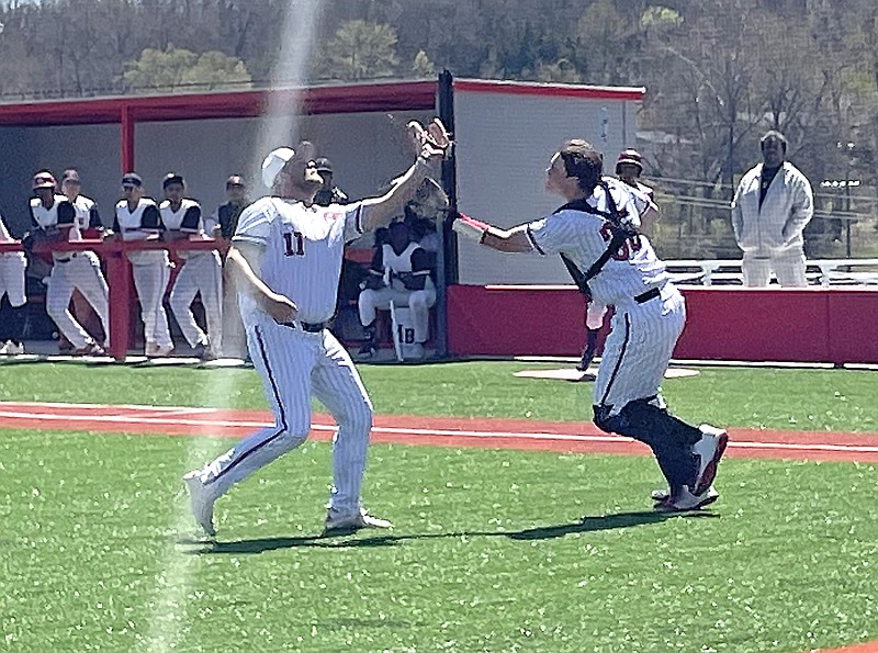 Jefferson City pitcher Zac Arnold (left) and catcher Mason Wall converge on an infield pop-up during Saturday's fifth-place game of the Jays Baseball Classic against Gateway Legacy at Jefferson City High School. (Kyle McAreavy/News Tribune)