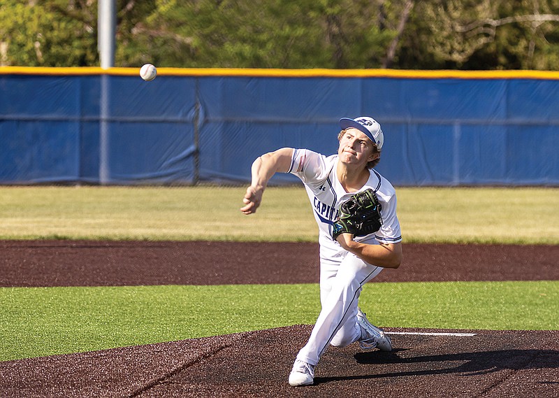 Capital City pitcher Brock Miles throws the ball to the plate during Friday night’s game against Russellville at Capital City High School. (Josh Cobb/News Tribune)