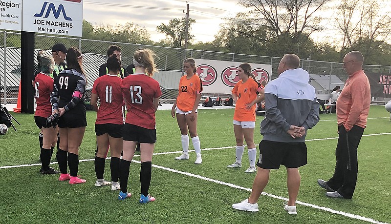 Team captains from the Jefferson City Lady Jays and the Waynesville Lady Tigers meet at midfield before the start of Friday night's game at Jefferson City High School. (Trevor Hahn/News Tribune)