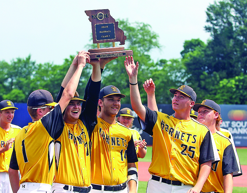 From left, St. Elizabeth seniors Levi Holtmeyer, Caleb Oligschlaeger, Jace Kesel, Lane Irwin and Trey Struemph hold up the Class 1 state championship trophy following the Hornets’ 13-3 win in six innings against the Platte Valley Longhorns at Sky Bacon Stadium in Ozark. (Greg Jackson/News Tribune)