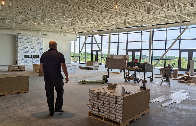 Shawn Strong, president of State Technical College of Missouri, stands in the middle of a 250-person event space in development at the new campus event and entertainment center. The two year technical college is wrapping up work on the building and expects to have it open before the end of August.