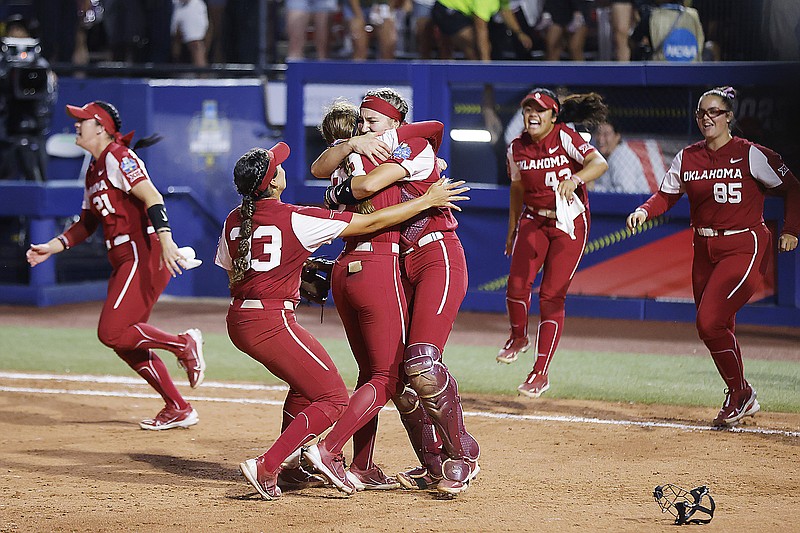 Oklahoma players celebrate after defeating Florida State in the NCAA Women's College World Series championship series Thursday in Oklahoma City. (Associated Press)