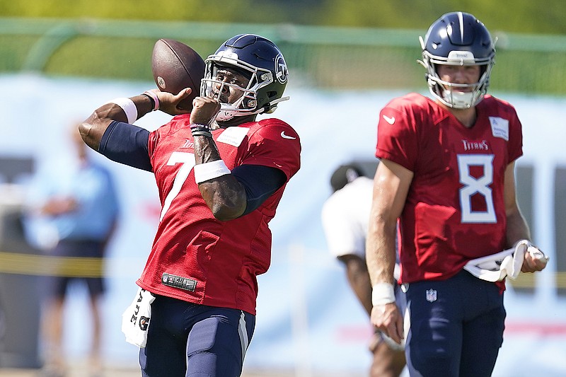 Tennessee Titans quarterback Malik Willis (7) tries to pass under