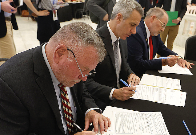 Rep. Marcus Richmond (from left), R-Harvey, Rep. John Maddox, R-Mena, and Rep. Steve Unger, R-Springdale, file their paperwork for for office Monday Nov. 6, 2023 at the state Capitol in Little Rock on the first day of candidate filing.
(Arkansas Democrat-Gazette/Thomas Metthe)