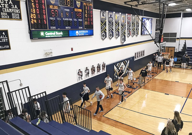 Helias basketball players walk off the court and toward the locker room following Tuesday night's 57-48 win against Hickman at Rackers Fieldhouse. (Greg Jackson/News Tribune)