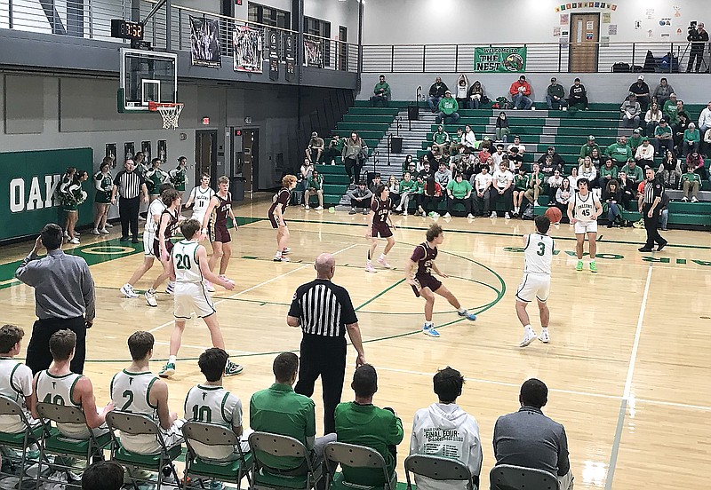 Nick Closser (3) passes the ball to Blair Oaks teammate Ryan Glavin on the opening possession of the fourth quarter during Tuesday night's game against Eldon at Blair Oaks High School in Wardsville. (Greg Jackson/News Tribune)