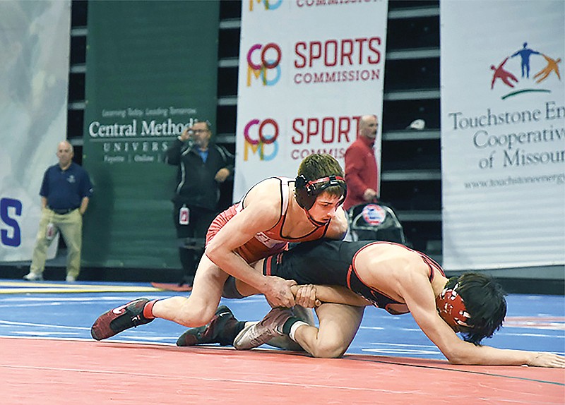 Jefferson City senior Braden Werdehausen secures a takedown against Fort Zumwalt South’s Cameron Clark in Saturday’s fourth-round wrestlebacks at 132 pounds during the Class 3 boys wrestling state championships at Mizzou Arena in Columbia. (Cleo Norman/News Tribune)