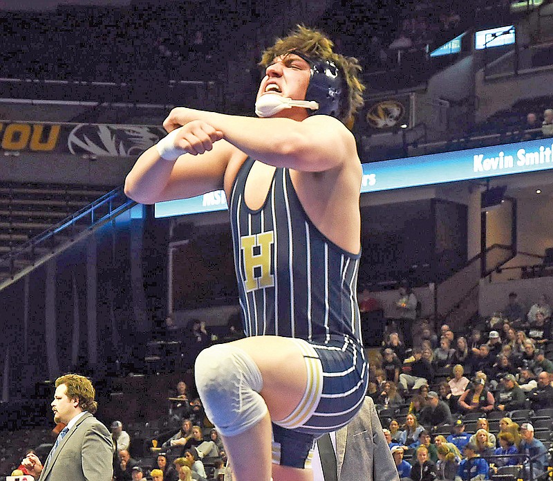 Helias senior Logan Montoya celebrates his win Saturday night after his 190-pound championship match against Kearney’s Jakweli Gist during the Class 3 boys wrestling state championships at Mizzou Arena in Columbia. (Cleo Norman/News Tribune)