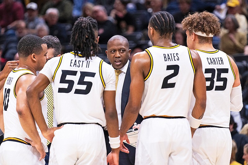 Missouri coach Dennis Gates talks with his team during the first half of Tuesday night’s game against Auburn at Mizzou Arena in Columbia. (Associated Press)