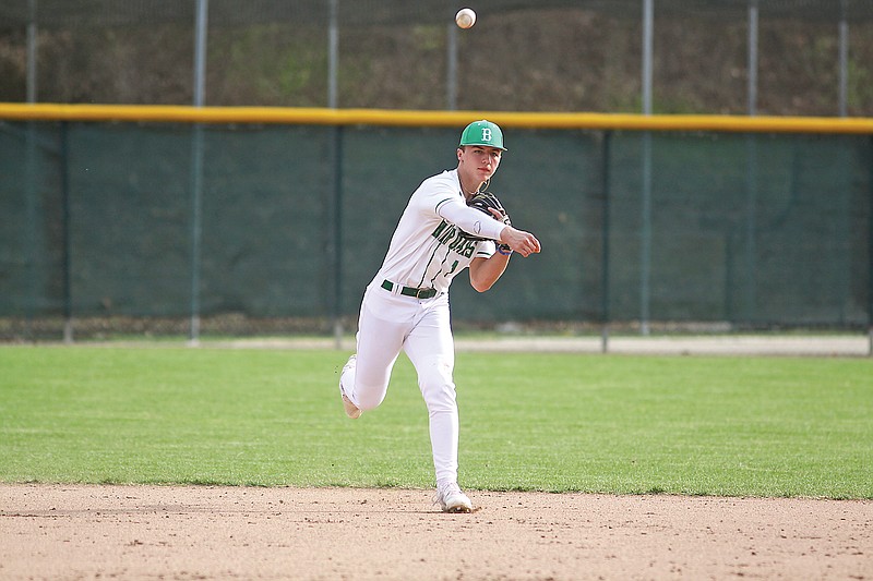 Blair Oaks shortstop Warren Davis throws the ball to first base for an out during Saturday afternoon's game against St. Elizabeth at Vivion Field. (Greg Jackson/News Tribune)