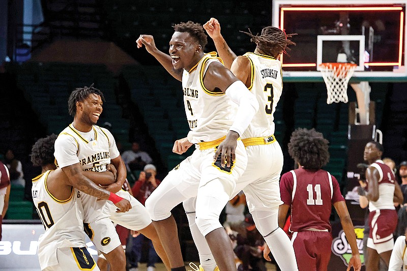 Grambling State forward Antwan Burnett (4) and guard Mikale Stevenson (3) celebrate Saturday after beating Texas Southern in the Southwestern Athletic Conference Tournament championship game in Birmingham, Ala. (Associated Press)