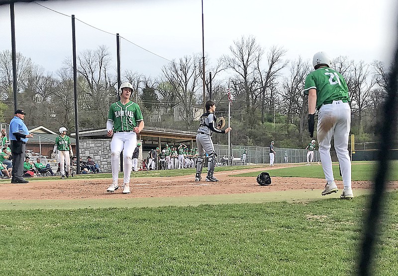 Blair Oaks' Colten Bryan (5) crosses home plate past Fulton catcher Justin Case after scoring on a single by Hayden Lackman during the third inning of Thursday night's game at Vivion Field. (Greg Jackson/News Tribune)
