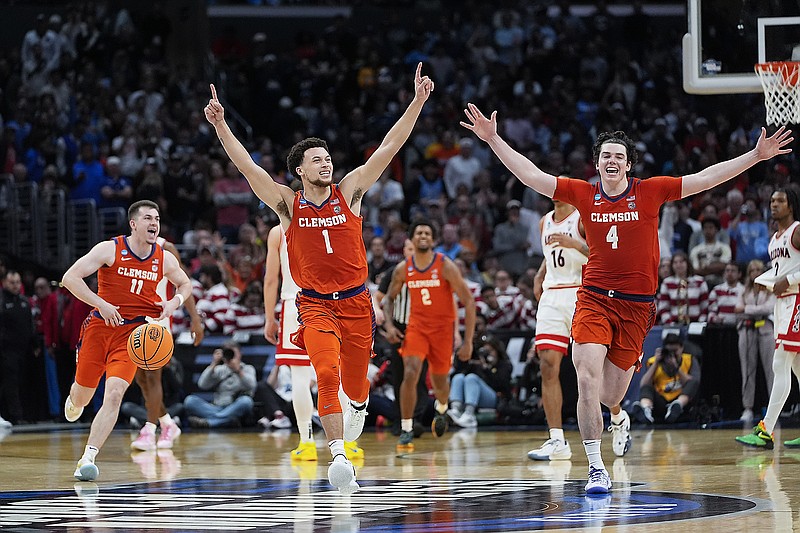 Clemson's Chase Hunter (1), Joseph Girard III (11) and Ian Schieffelin (4) celebrate after Thursday night's win against Arizona in a West Region semifinal game of the men's NCAA tournament in Los Angeles. (Associated Press)