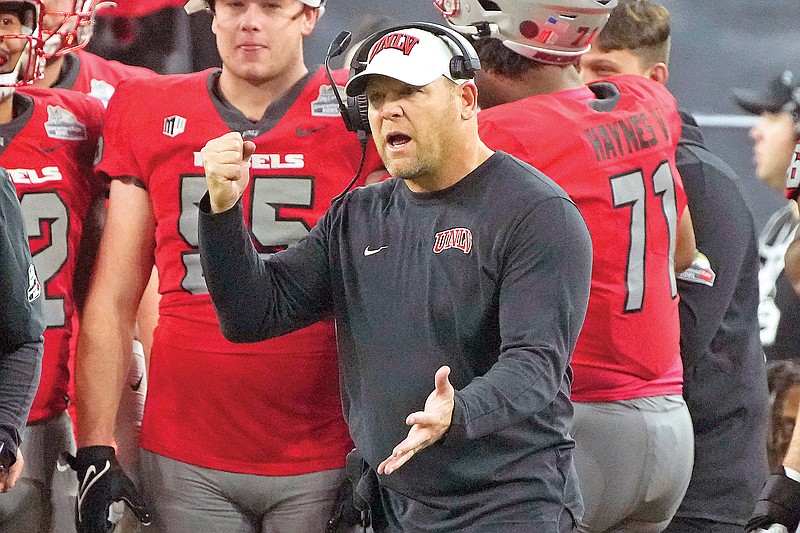 In this Dec. 26, 2023, file photo, UNLV coach Barry Odom reacts to his defense during the second half of the Guaranteed Rate Bowl against Kansas in Phoenix. (Associated Press)