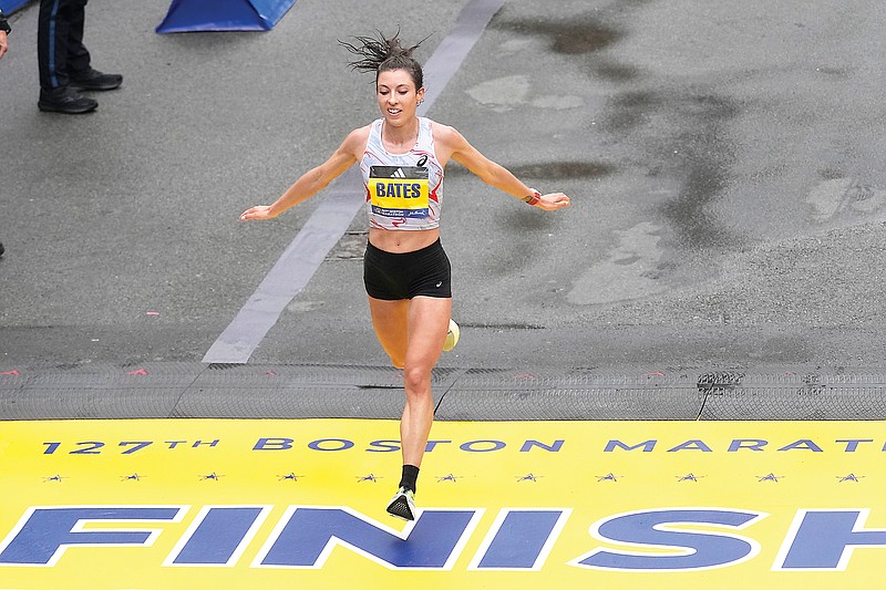 In this April 17, 2023, file photo, Emma Bates crosses the finish line of the Boston Marathon in Boston. (Associated Press)