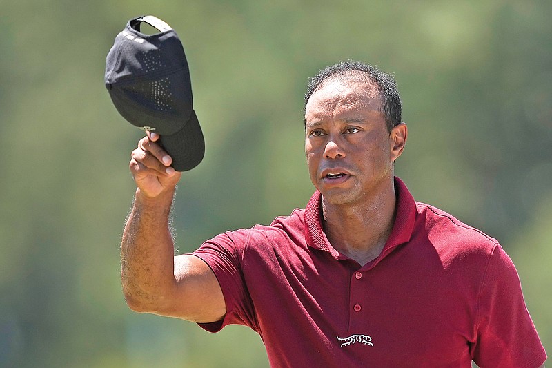 Tiger Woods waves his hat to the crowd after Sunday’s final round of the Masters at Augusta National Golf Club in Augusta, Ga. (Associated Press)