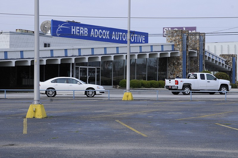 Staff file photo / The Herb Adcox delearship on Lee Highway is show in 2013 shortly after the last cars were moved off the lot when then bankrupt General Motors reduced its GM dealership network; the Lee Highway property of the car dealership is being bought for $6 million by the Chattanooga Airport.