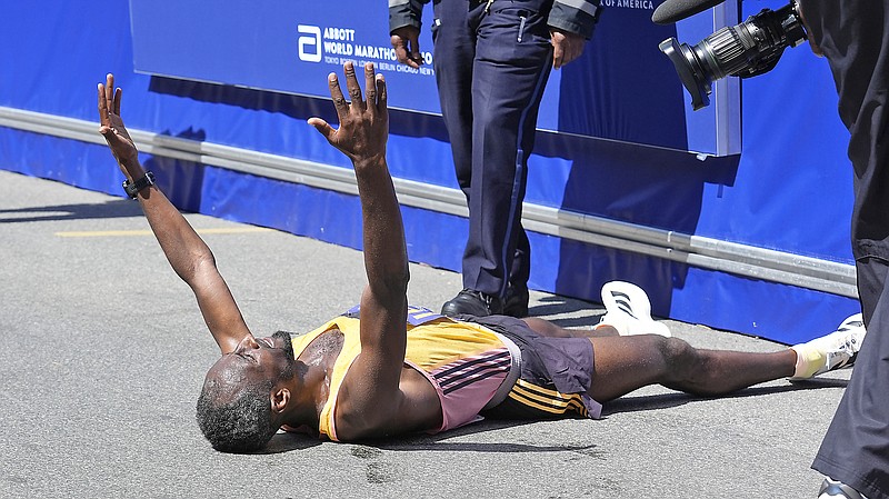 Sisay Lemma celebrates while lying down after winning the Boston Marathon on Monday in Boston. (Associated Press)