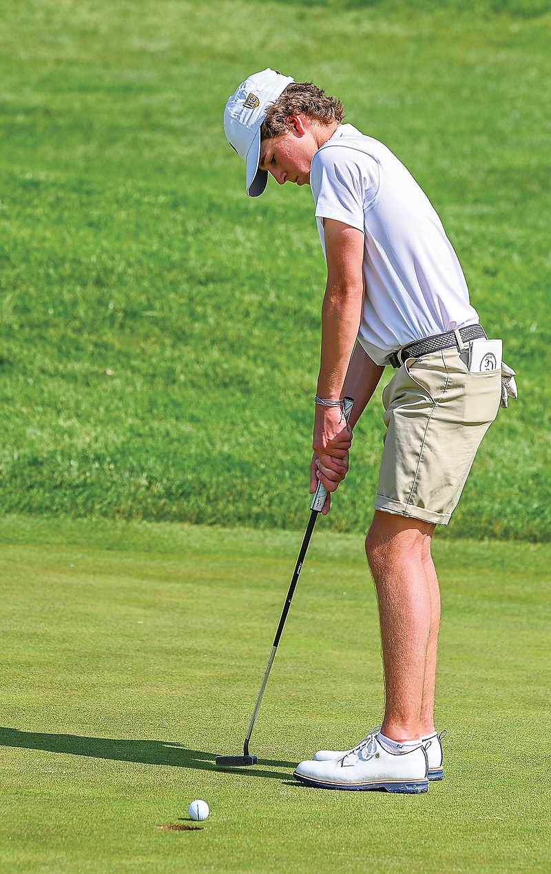 Grayson Moore of Helias putts the ball on the sixth green during his round Monday in the Helias Invitational at Jefferson City Country Club. (Julie Smith/News Tribune)