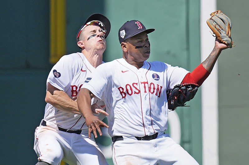 Rafael Devers collides with Red Sox teammate Tyler O'Neil after making the catch on a popout by Estevan Florial of the Guardians during the seventh inning of Monday's game in Boston. (Associated Press)