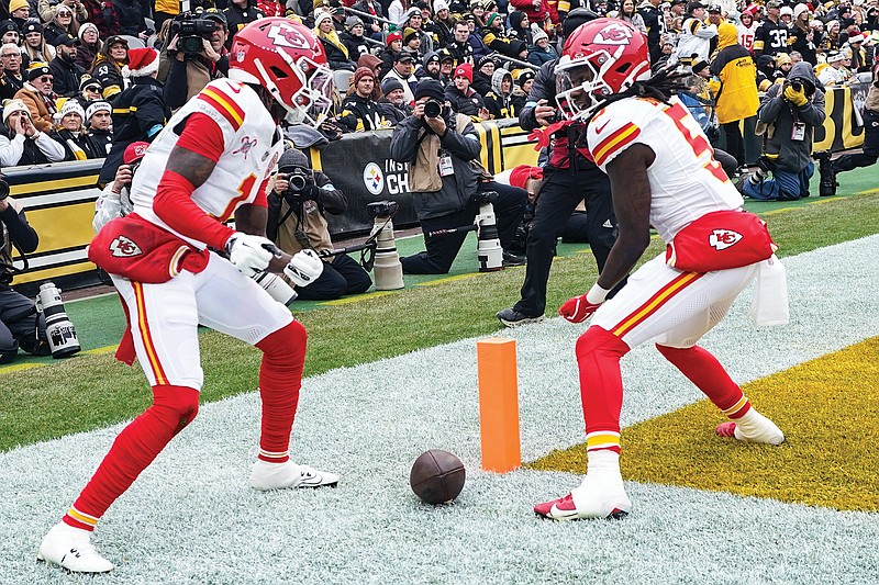 In this Dec. 25, 2024, file photo, Chiefs wide receiver Xavier Worthy (left) celebrates his touchdown with Hollywood Brown during a game against the Steelers in Pittsburgh. (Associated Press)