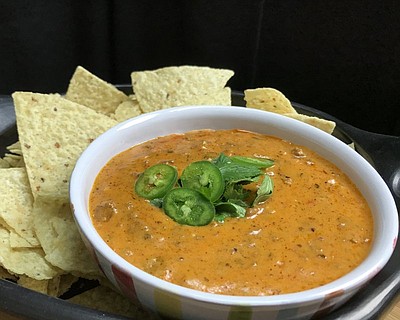 Taco Queso Dip makes a great Super Bowl meal