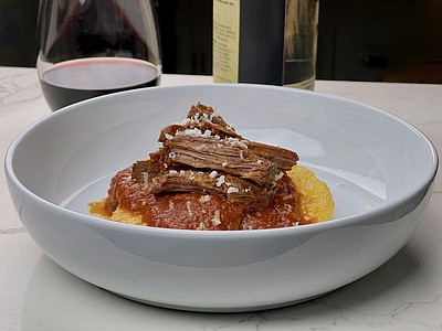Braised Beef in Tomato Sauce Over Polenta