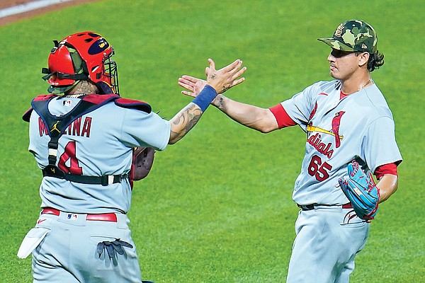 Yadier Molina pitches for Cardinals against Pirates