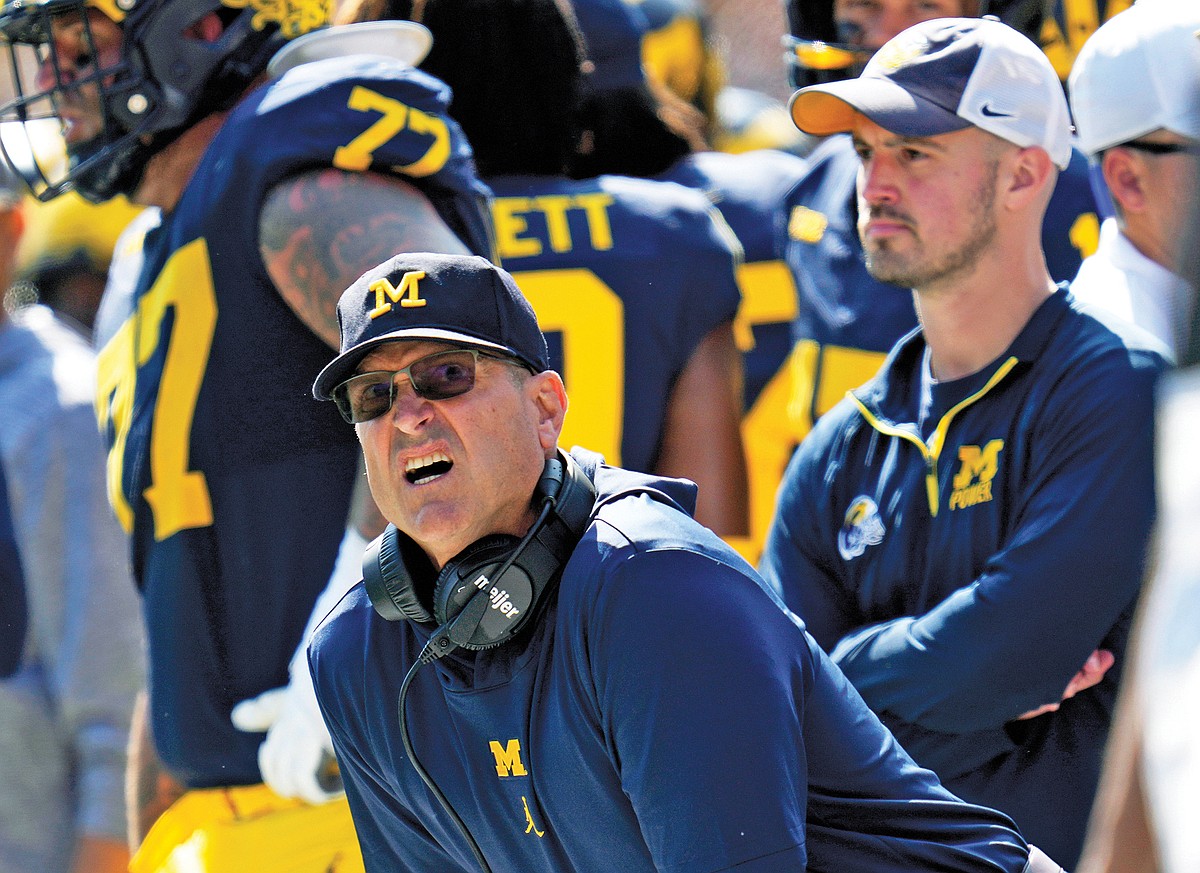 NCAA fines Michigan millions, suspends Moore three games in sign-stealing scandal