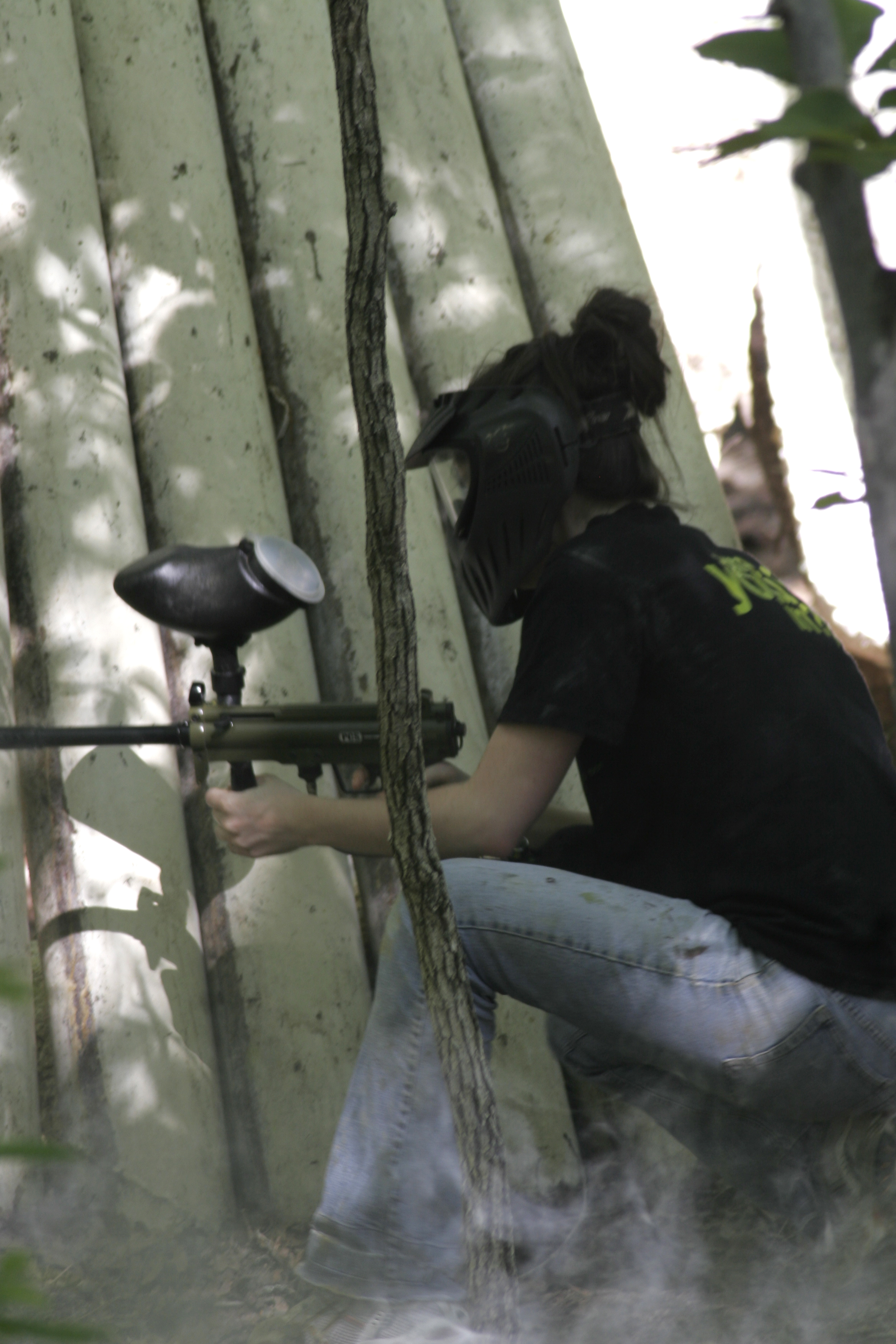 In the Ewok Village, Shannon hides behind natural growing piping.