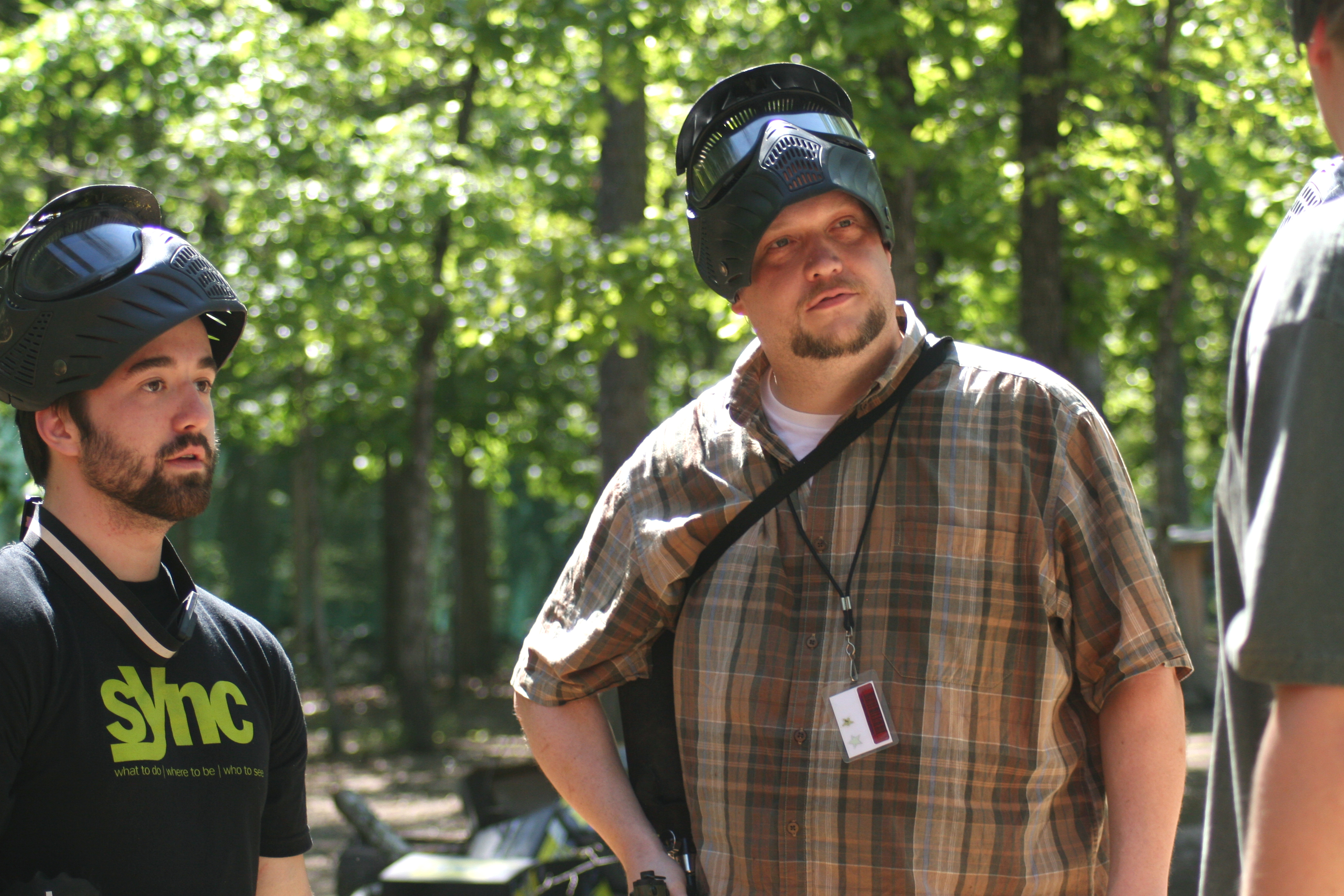 Dan listens closely as the others give him advice about not dying in paintball.